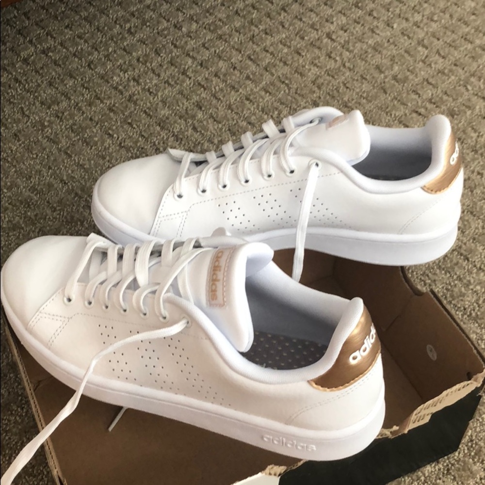 Adidas Cloudfoam white sneakers with gold trim